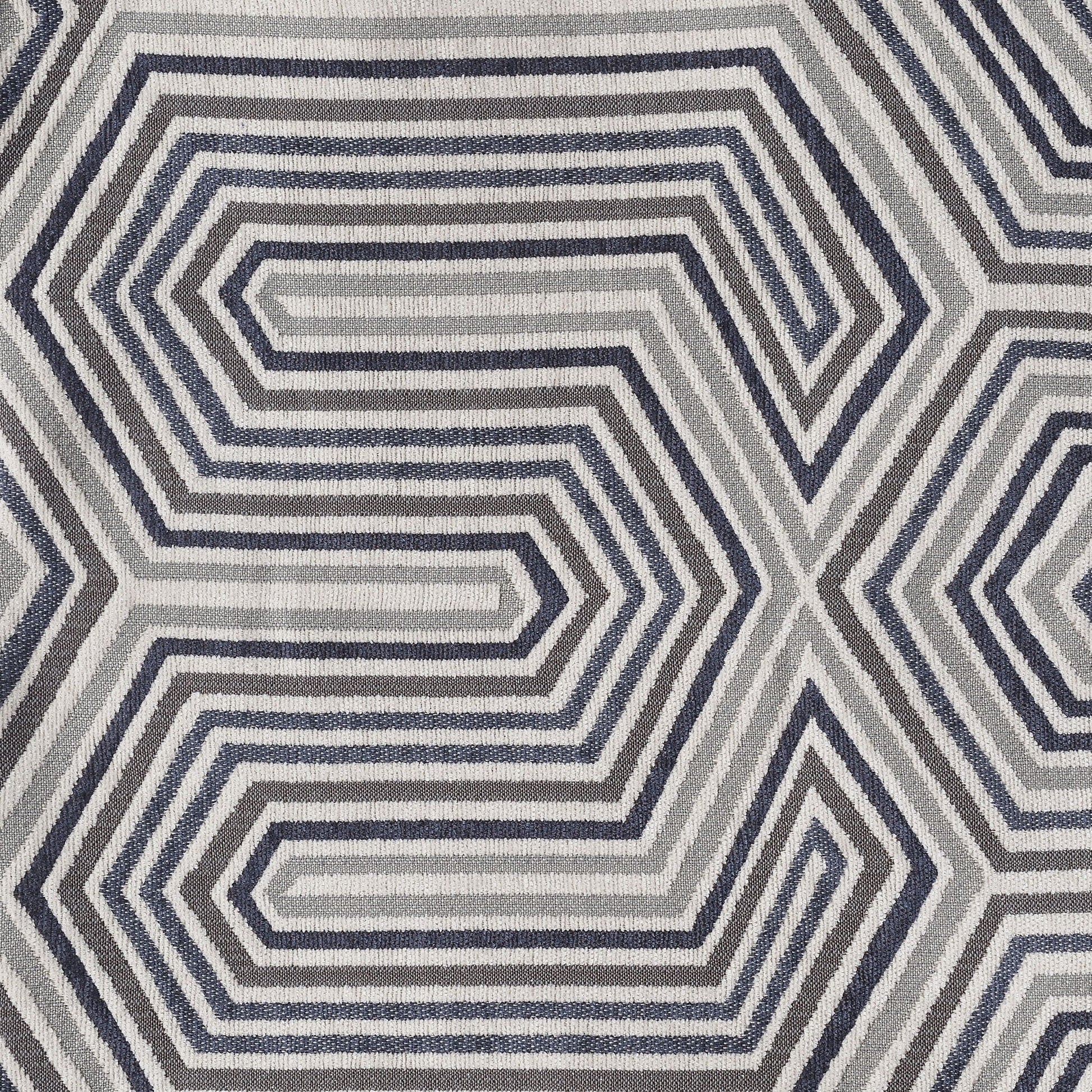 Geometric area rug with concentric hex stripe pattern in gray navy and ivory on Tampa Home & Garden Store