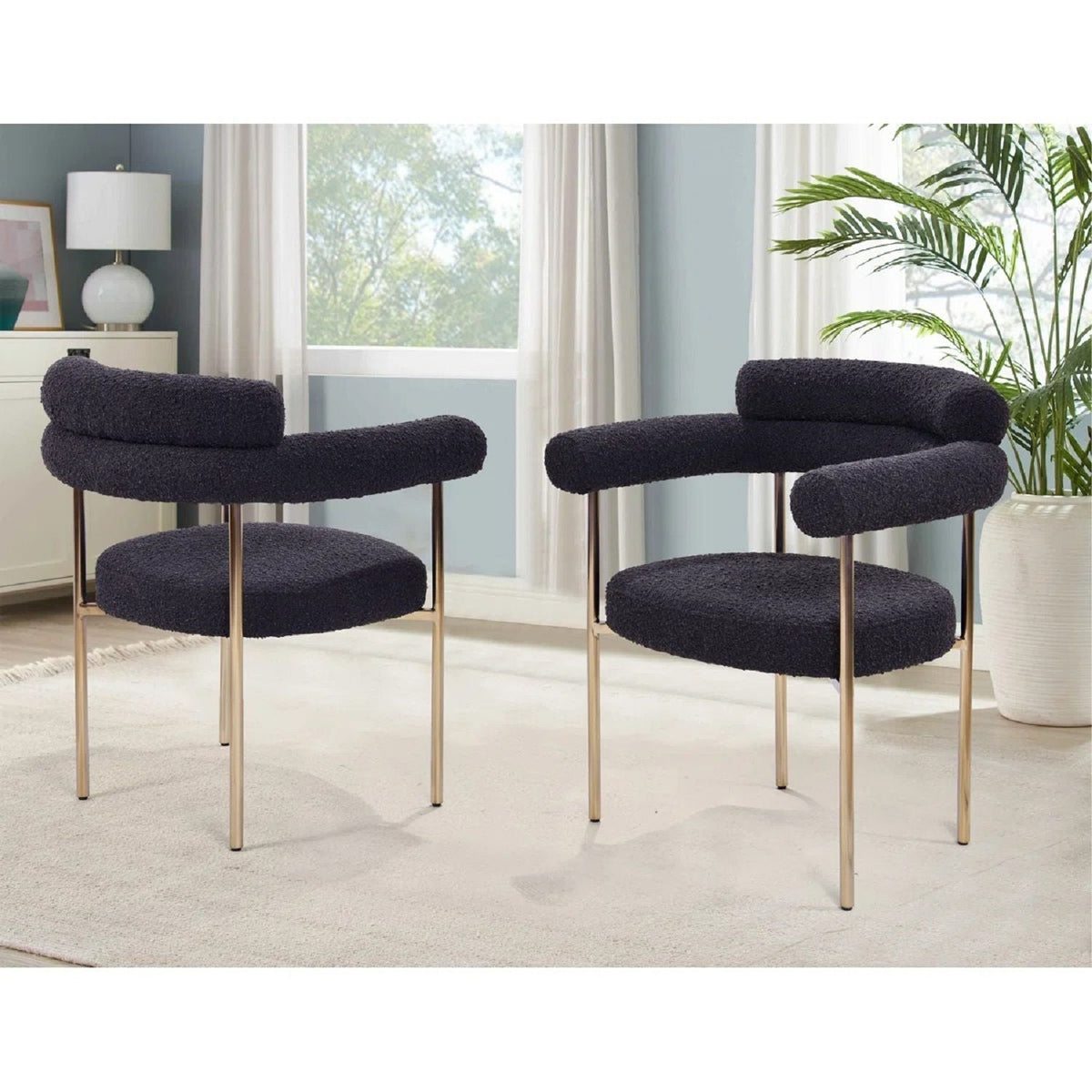 Upholstered dining chairs set of 2 in black boucle with curved armrests and gold-tone legs on Tampa Home & Garden Store
