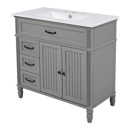 Bathroom vanity with sink and drawers in gray wood with white countertop and black hardware on Tampa Home & Garden Store