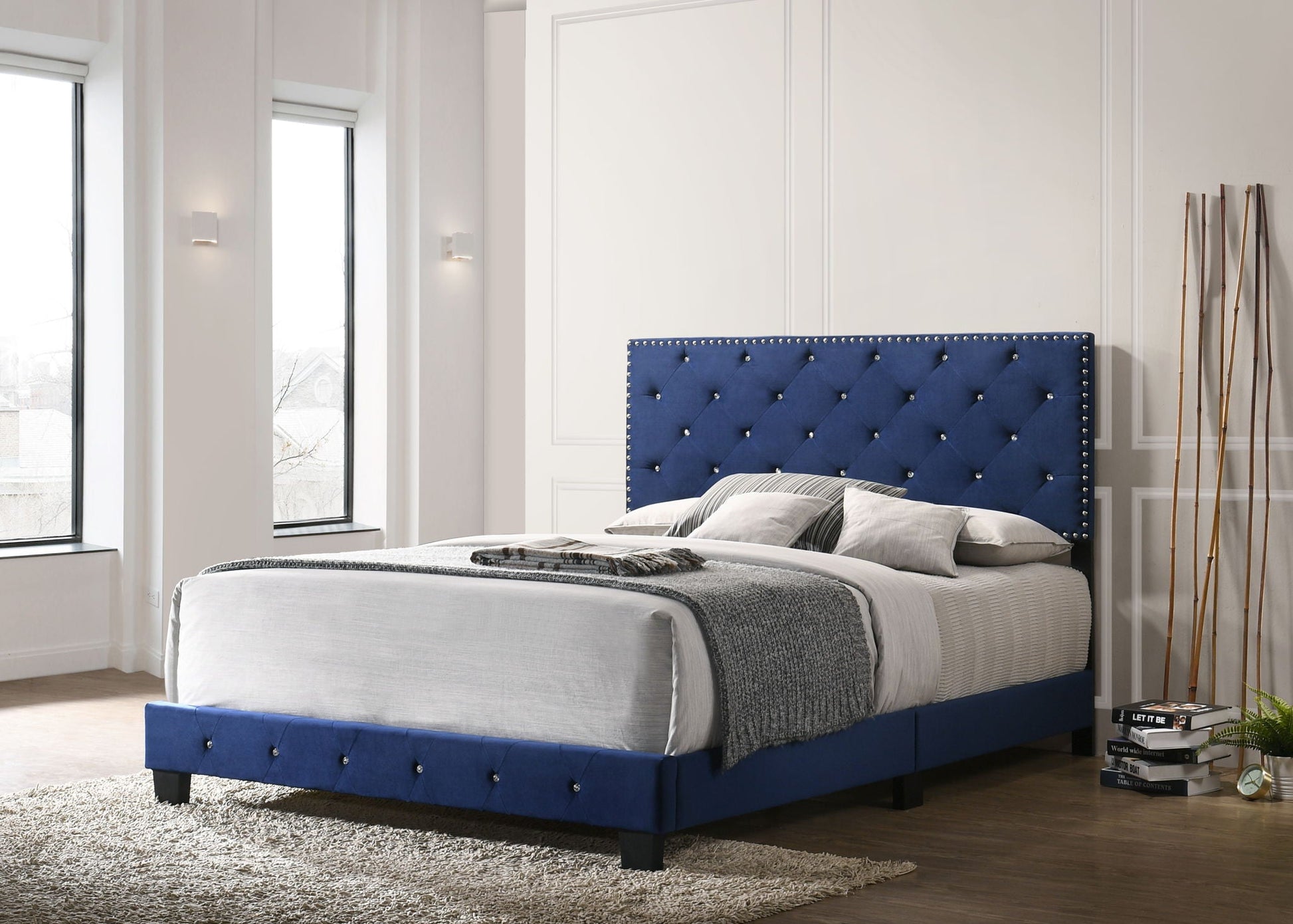 Luxurious blue upholstered bed with tufted headboard and nailhead trim by HouseOfZazla on Tampa Home & Garden Store