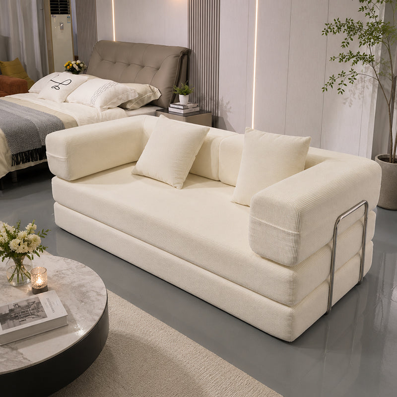 Double Sofa Bed in ivory cream fabric with plush cushions and chrome arms in a modern showroom on Tampa Home & Garden Store