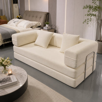 Double Sofa Bed in ivory cream fabric with plush cushions and chrome arms in a modern showroom on Tampa Home & Garden Store
