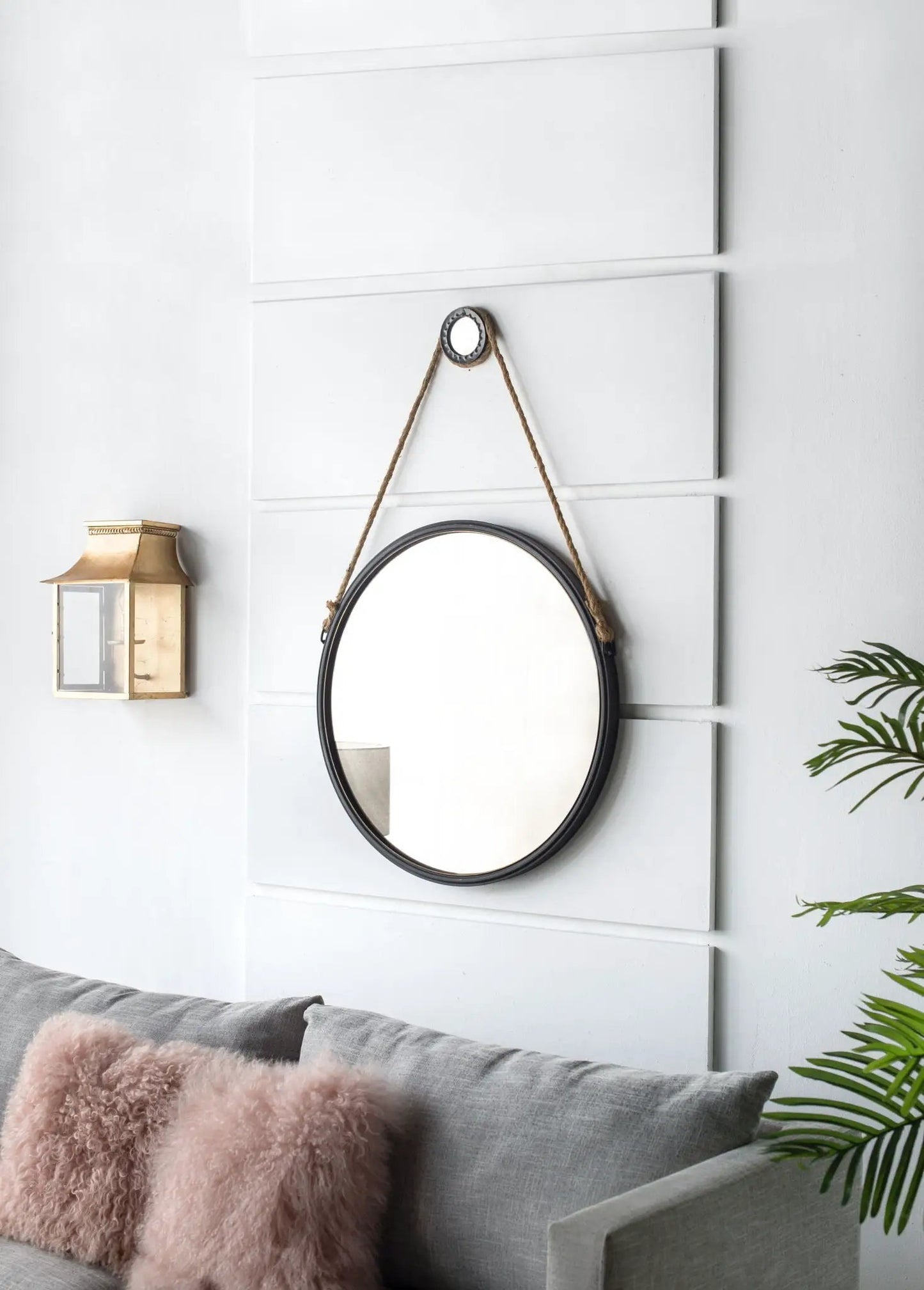 Handsome Cleveland mirror with rope strap, round black metal frame on white wall on Tampa Home & Garden Store