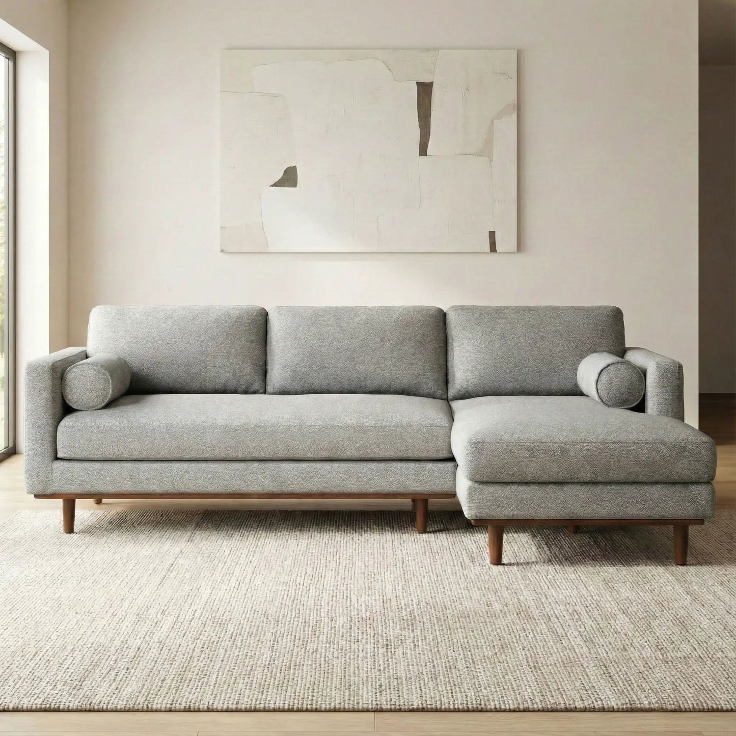 Morrison upholstered stationary sectional sofa in gray fabric with wood legs and end bolsters on Tampa Home & Garden Store