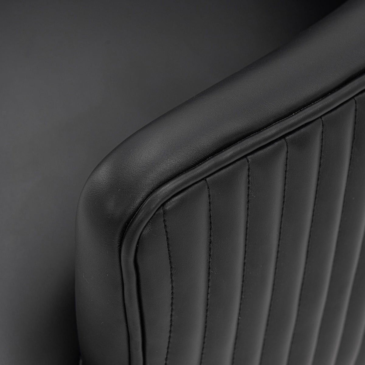 Modern Dining Chair with solid wood frame in black faux leather, stitched seam detail on Tampa Home & Garden Store
