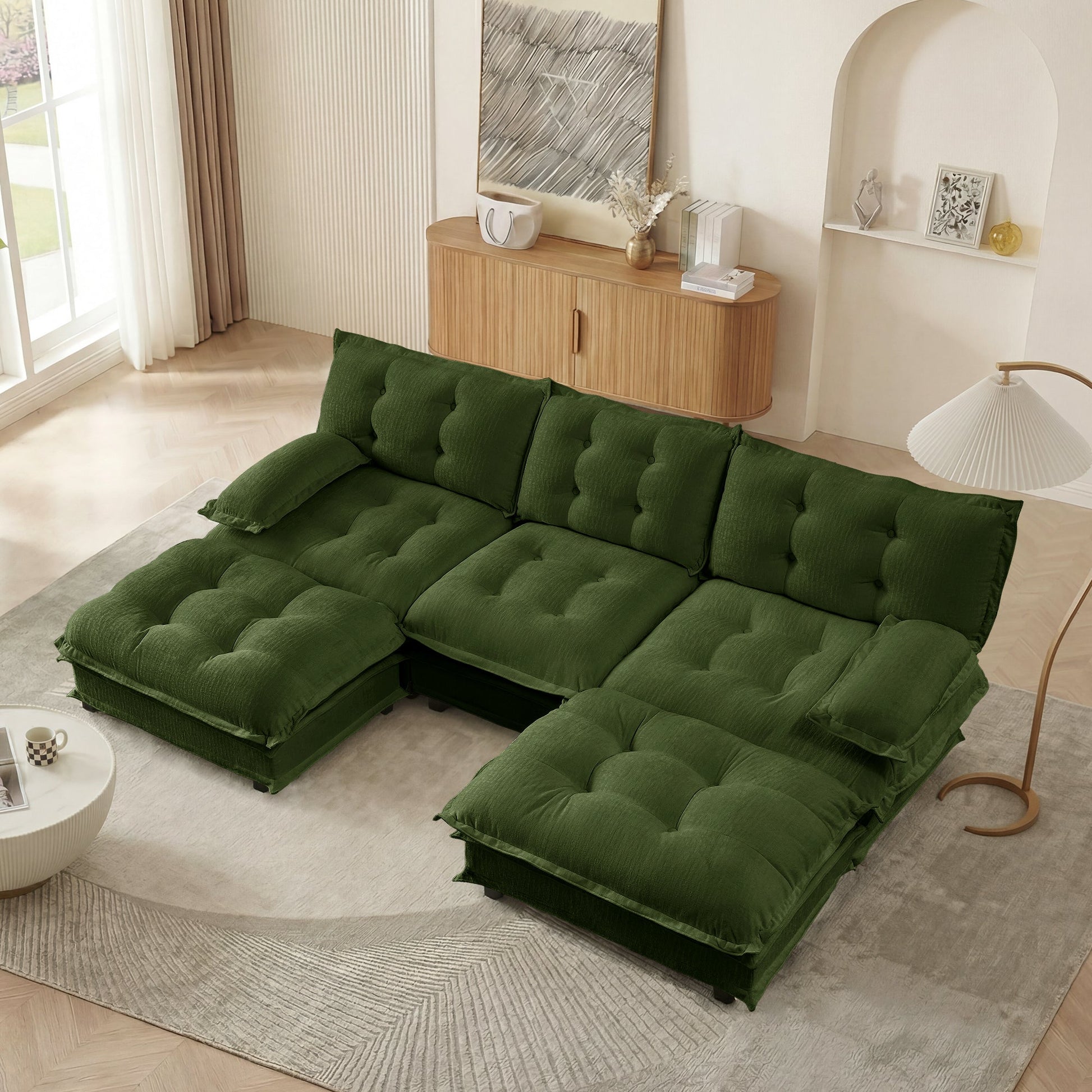 107-inch U-shaped modern sofa sectional in green tufted fabric with ottomans in living room on Tampa Home & Garden Store