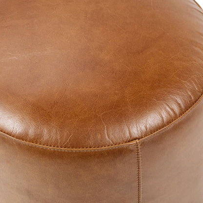 Brown leather round ottoman by HouseOfZazla with textured leather and visible stitching on Tampa Home & Garden Store