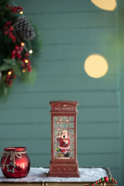 Red Christmas lighted phone booth with Santa inside, snow scene, requires 3 AA batteries on Tampa Home & Garden Store