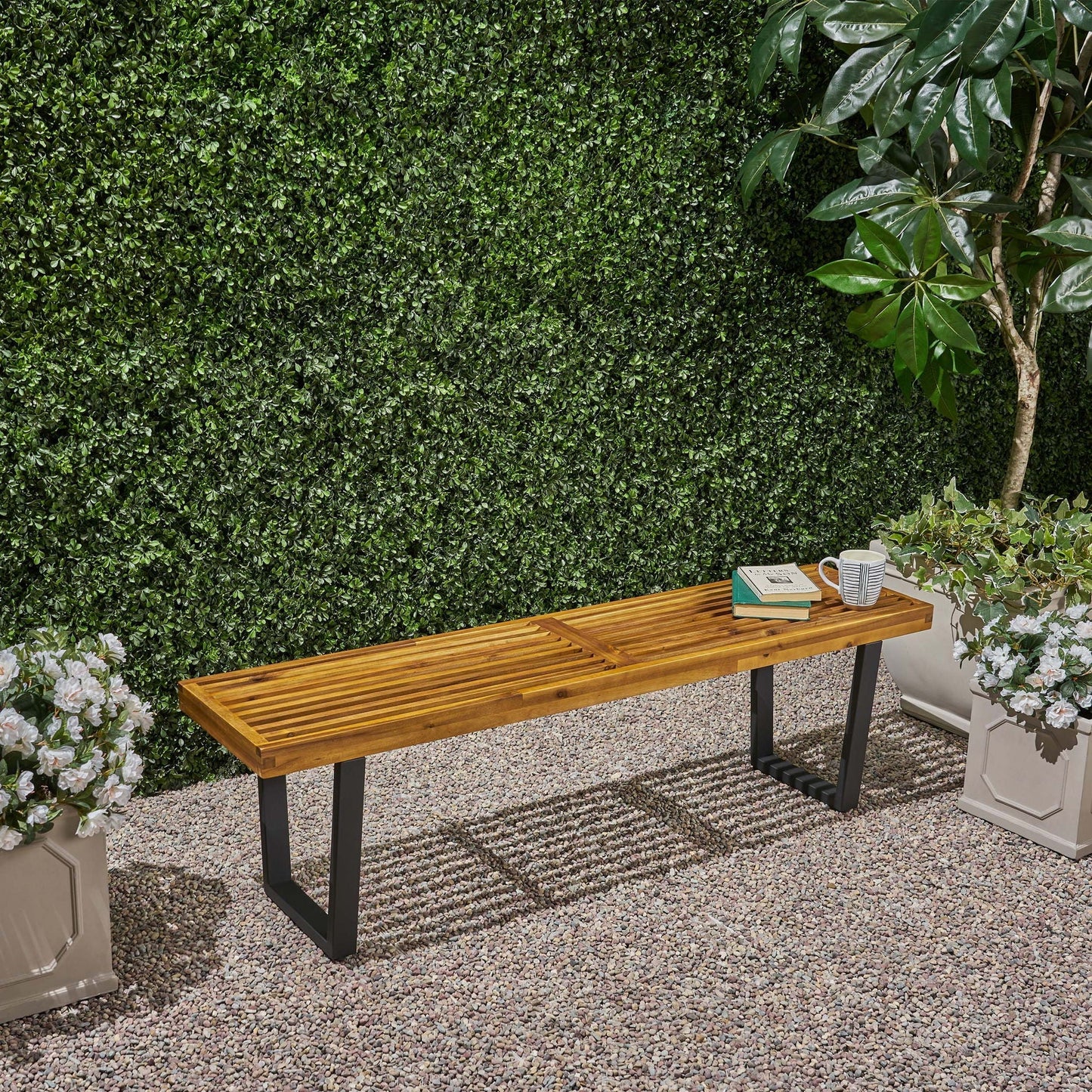 Intrinsic Outdoor Dining Bench With Slat Top wooden slats and black metal legs on Tampa Home & Garden Store