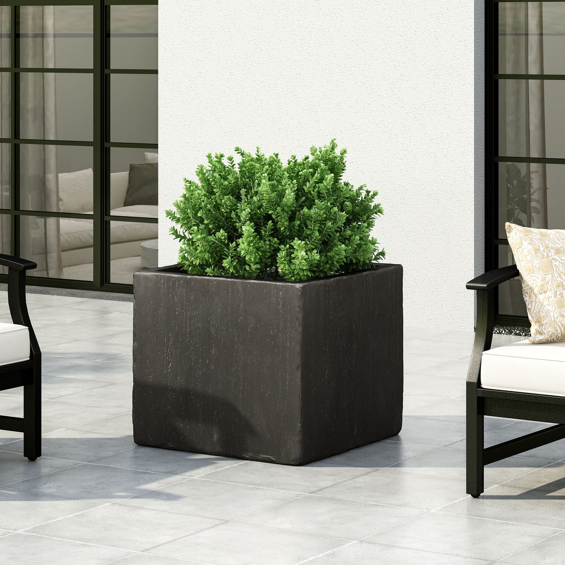 Modern Outdoor Planter by HouseOfZazla, black rectangular stone-look planter with green shrub on Tampa Home & Garden Store