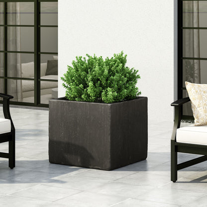 Modern Outdoor Planter by HouseOfZazla, black rectangular stone-look planter with green shrub on Tampa Home & Garden Store