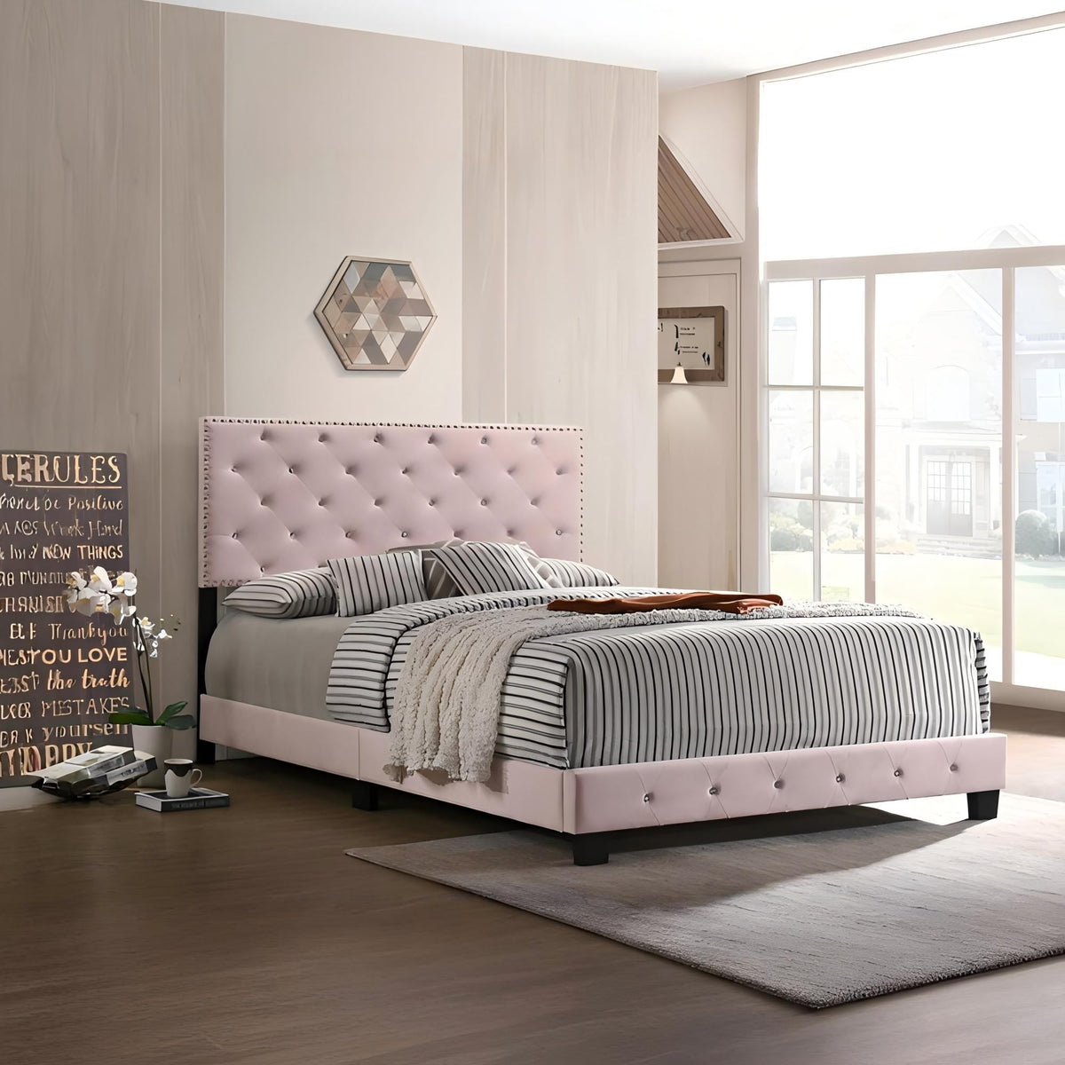 Luxurious Upholstered Bed by HouseOfZazla with pale pink headboard and striped bedding on Tampa Home & Garden Store