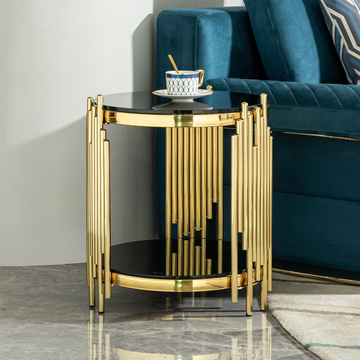 Elegant side table with double layer tempered glass top on gold frame beside teal sofa on Tampa Home & Garden Store