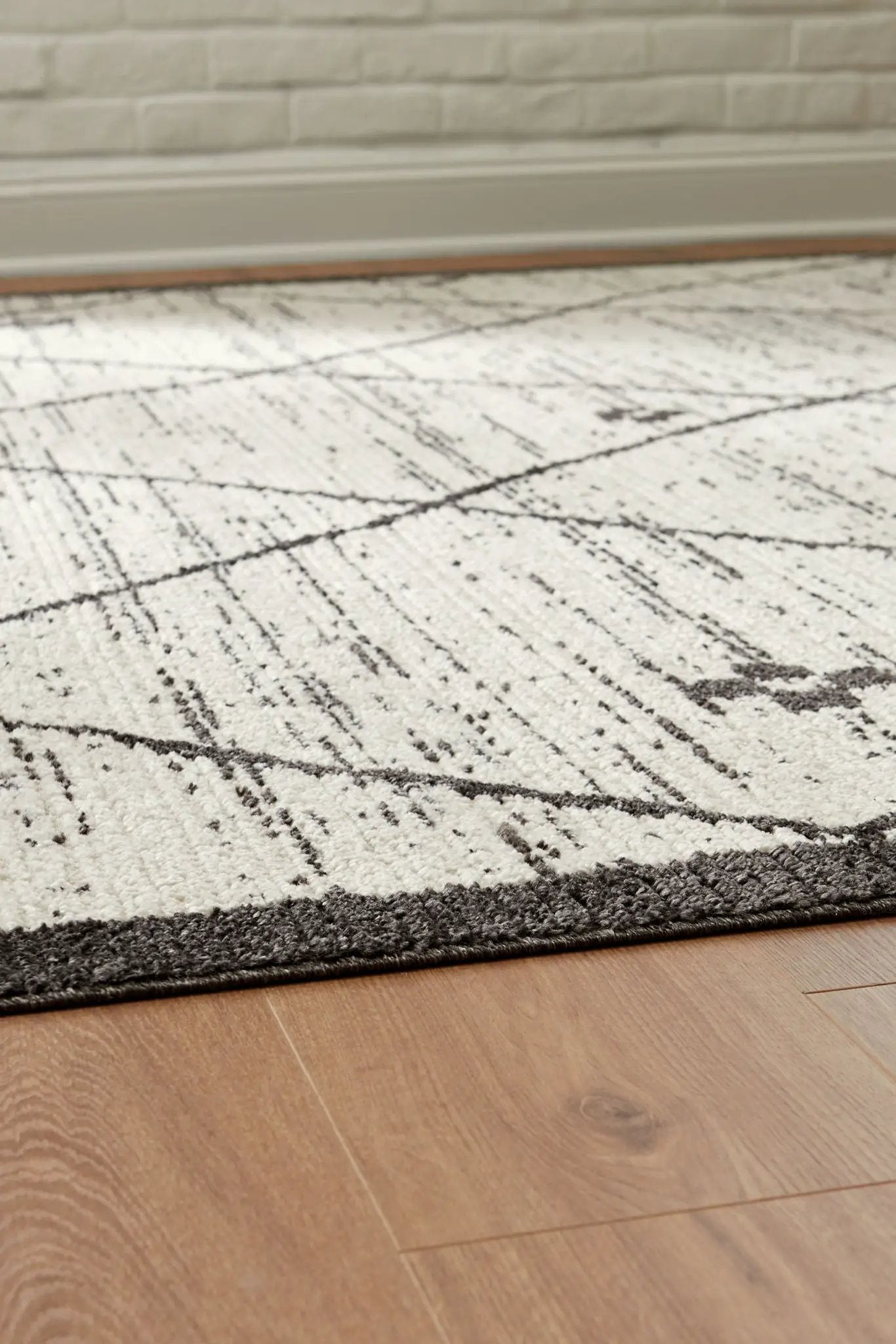 Fenriston Rug, cream with charcoal geometric lines and dark border, Unique Piece Furniture on Tampa Home & Garden Store