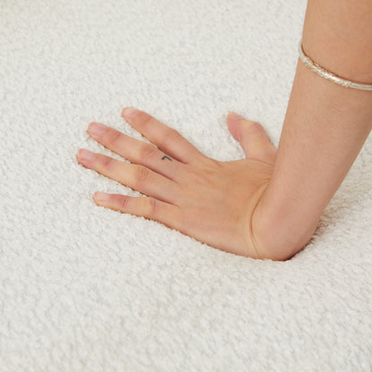 Sofas HouseOfZazla hand resting on light textured carpet with silver bracelet on Tampa Home & Garden Store