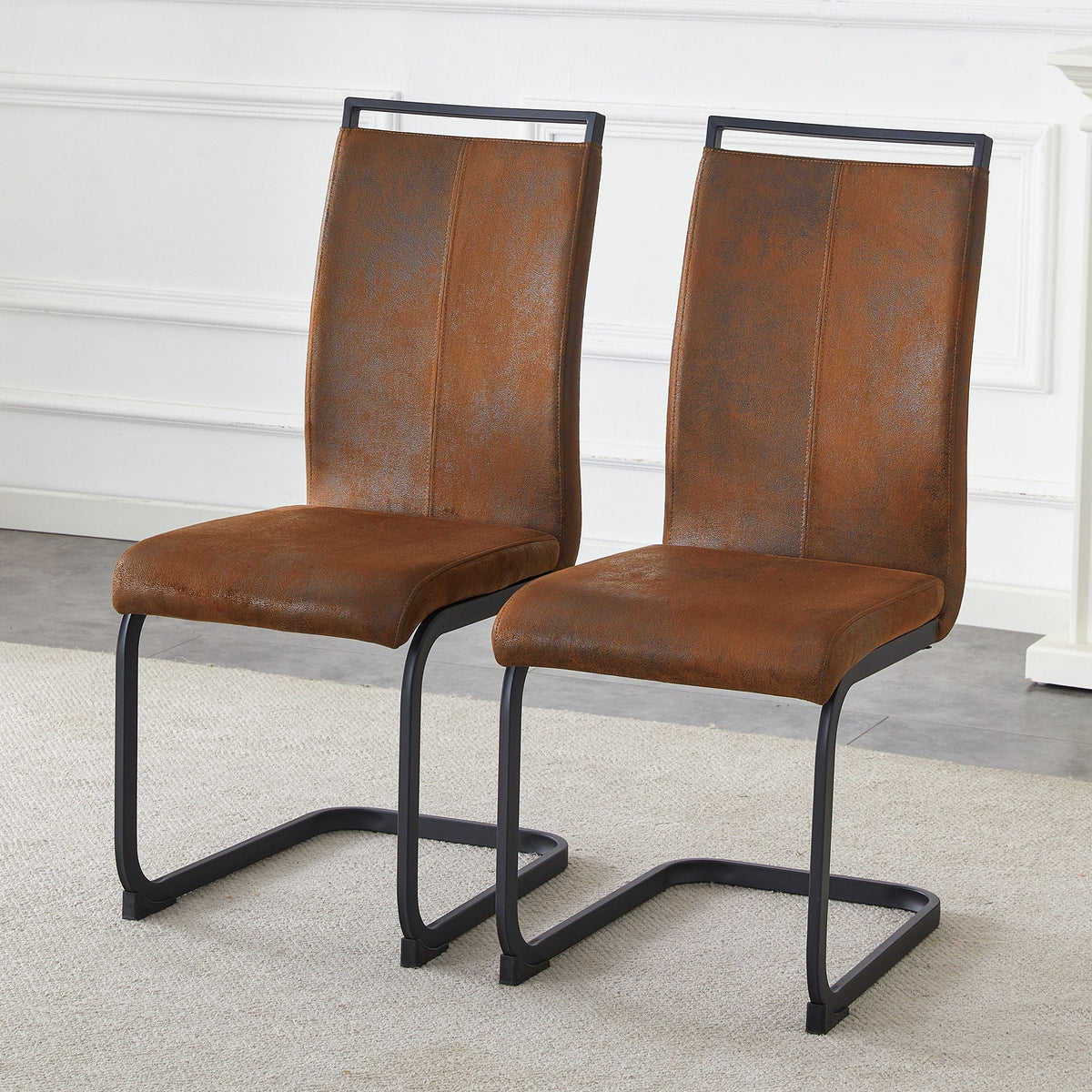 Dining chairs with ergonomic backrest in brown bonded leather and black metal base 2-pack on Tampa Home & Garden Store