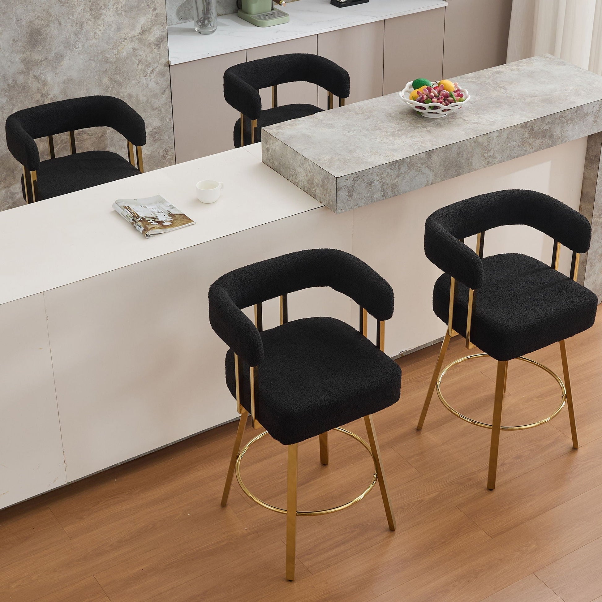 Upholstered side chair set of 2 in black fabric with gold legs around marble counter on Tampa Home & Garden Store