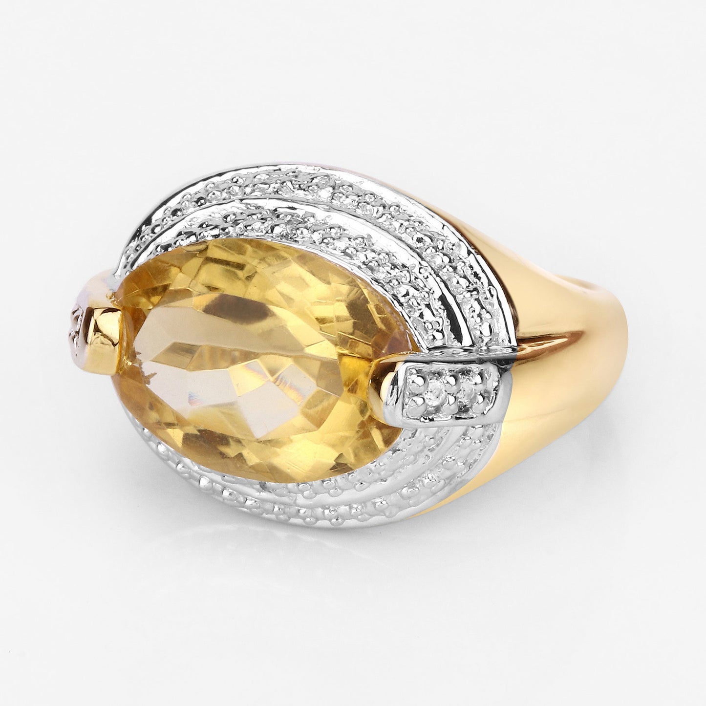 Two-tone ring with yellow citrine and pavé diamond halo on a silver band with gold accents on Tampa Home & Garden Store