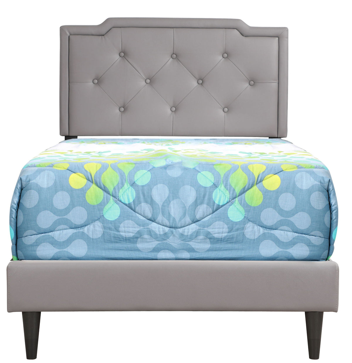 Button-tufted upholstered bed headboard in grey with diamonds, blue quilt with lime circles on Tampa Home & Garden Store