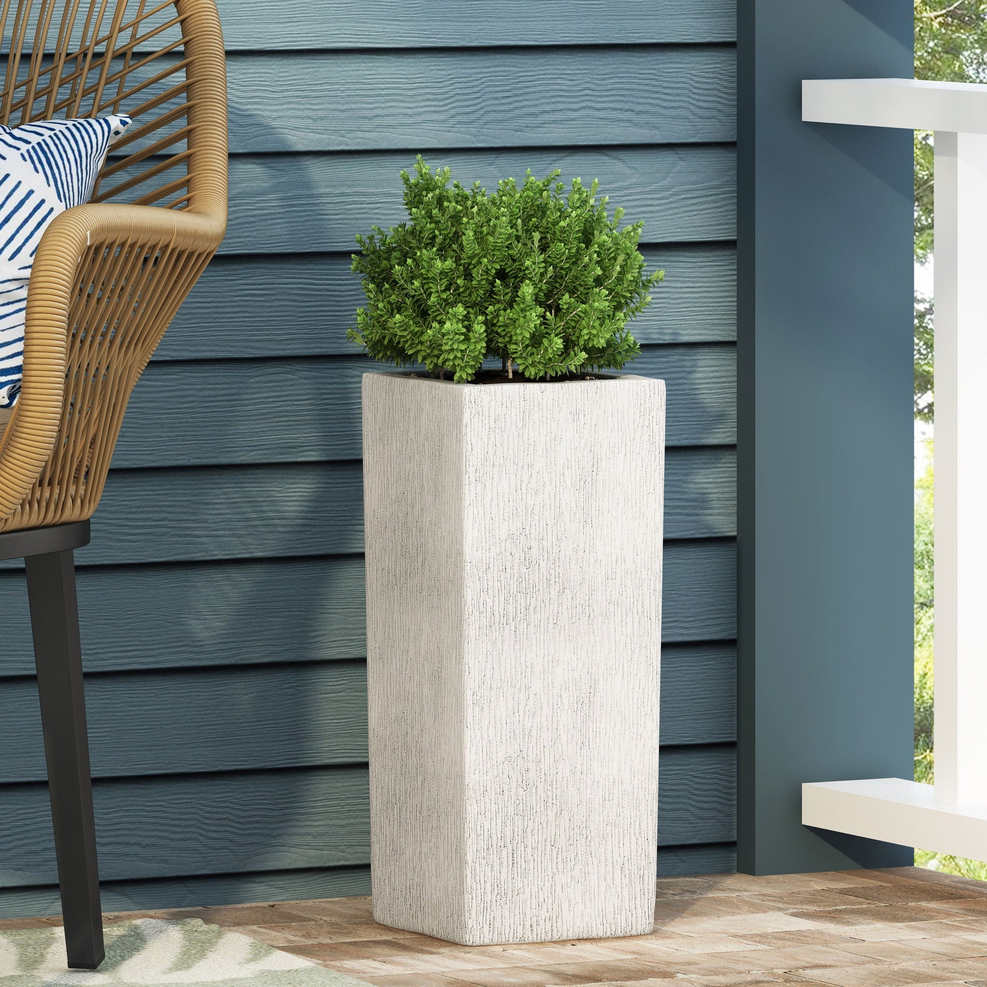 Modern Outdoor Planter by HouseOfZazla, tall textured planter with lush green shrub on Tampa Home & Garden Store
