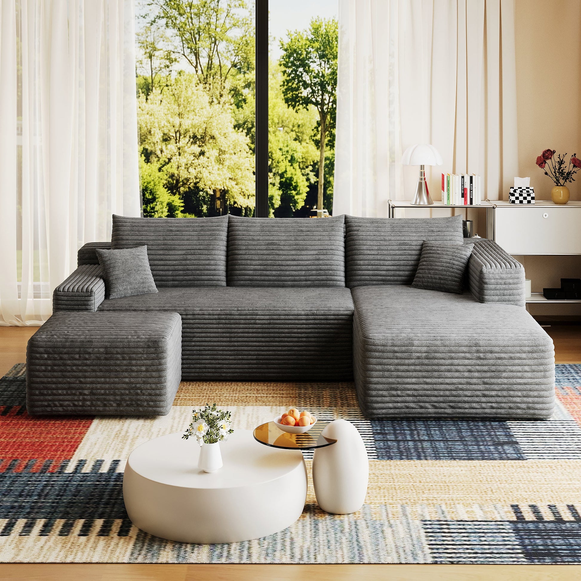 95in Cloud Sectional Sofa with Ottoman in charcoal gray fabric in living room with sheer curtains on Tampa Home & Garden Store