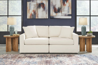 Modmax Oyster sectional by Unique Piece Furniture, cream fabric with navy backdrop on Tampa Home & Garden Store