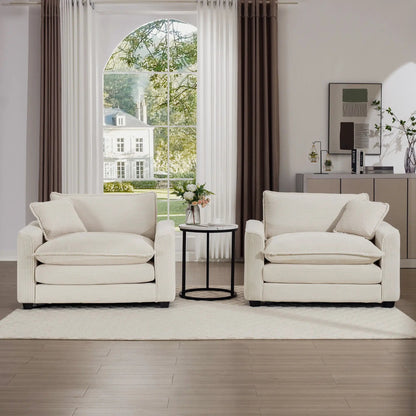 Modern Classic fabric armchairs pair in cream with pillows by an arched window on Tampa Home & Garden Store