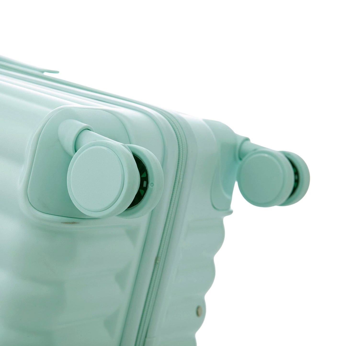 Spinner luggage wheel closeup in mint green on a carry-on suitcase on Tampa Home & Garden Store