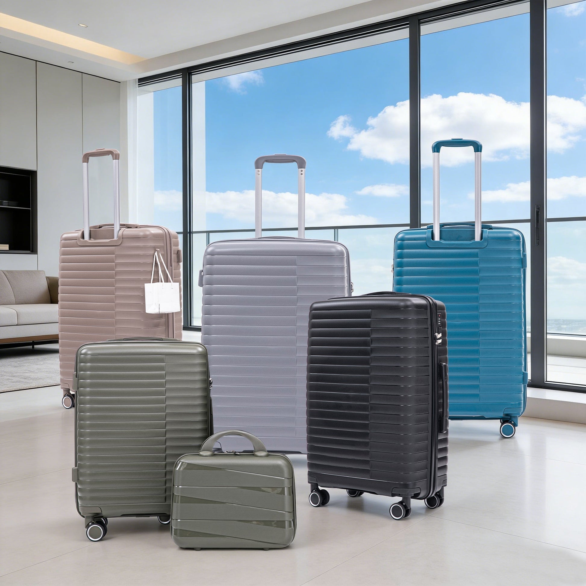 4-piece PP spinner luggage set with cosmetic case in light gray, taupe, and blue on Tampa Home & Garden Store