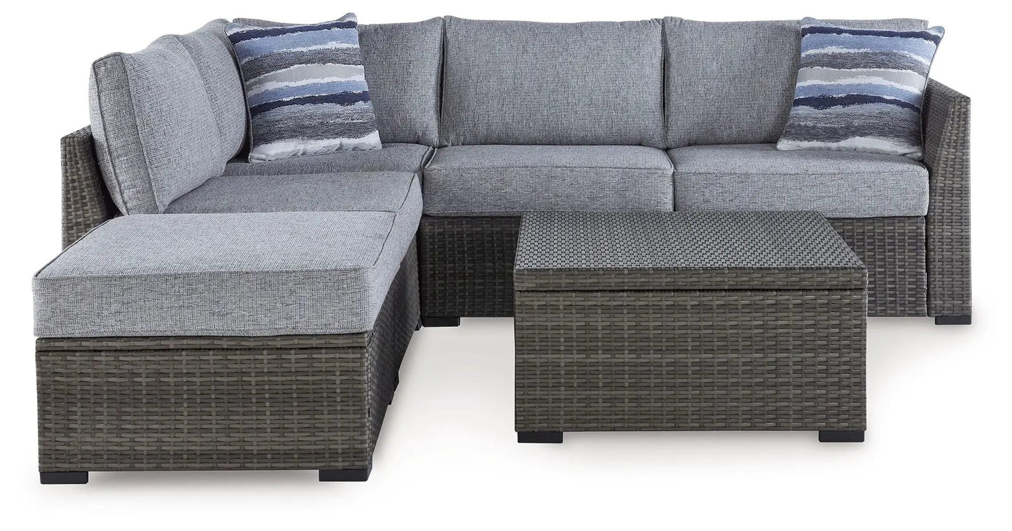 Petal Road gray outdoor wicker 4-piece set: loveseat, ottoman, table with blue striped pillows on Tampa Home & Garden Store