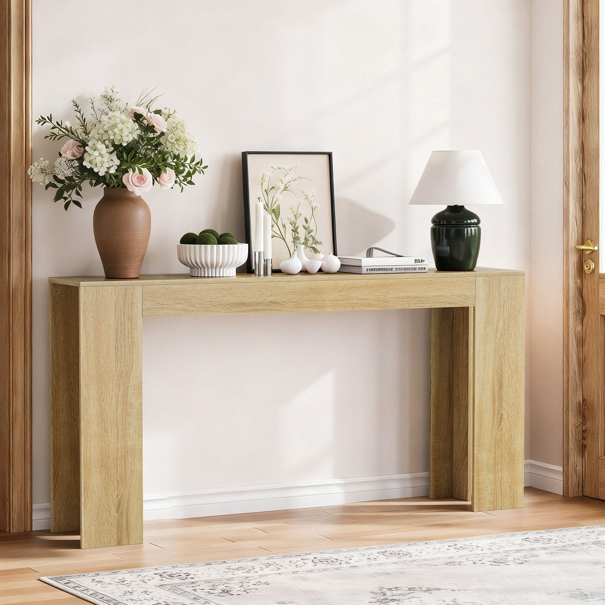 Farmhouse style console table in light oak with thick square legs, paired with vase and lamp on Tampa Home & Garden Store