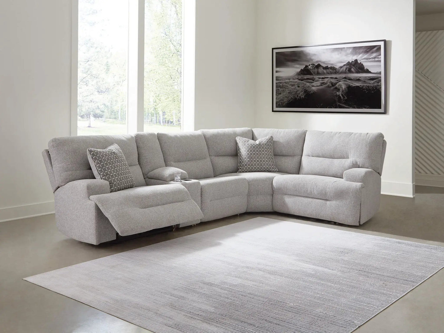 Acklen Place Reclining Sectional in light gray fabric with geometric pillows on Tampa Home & Garden Store