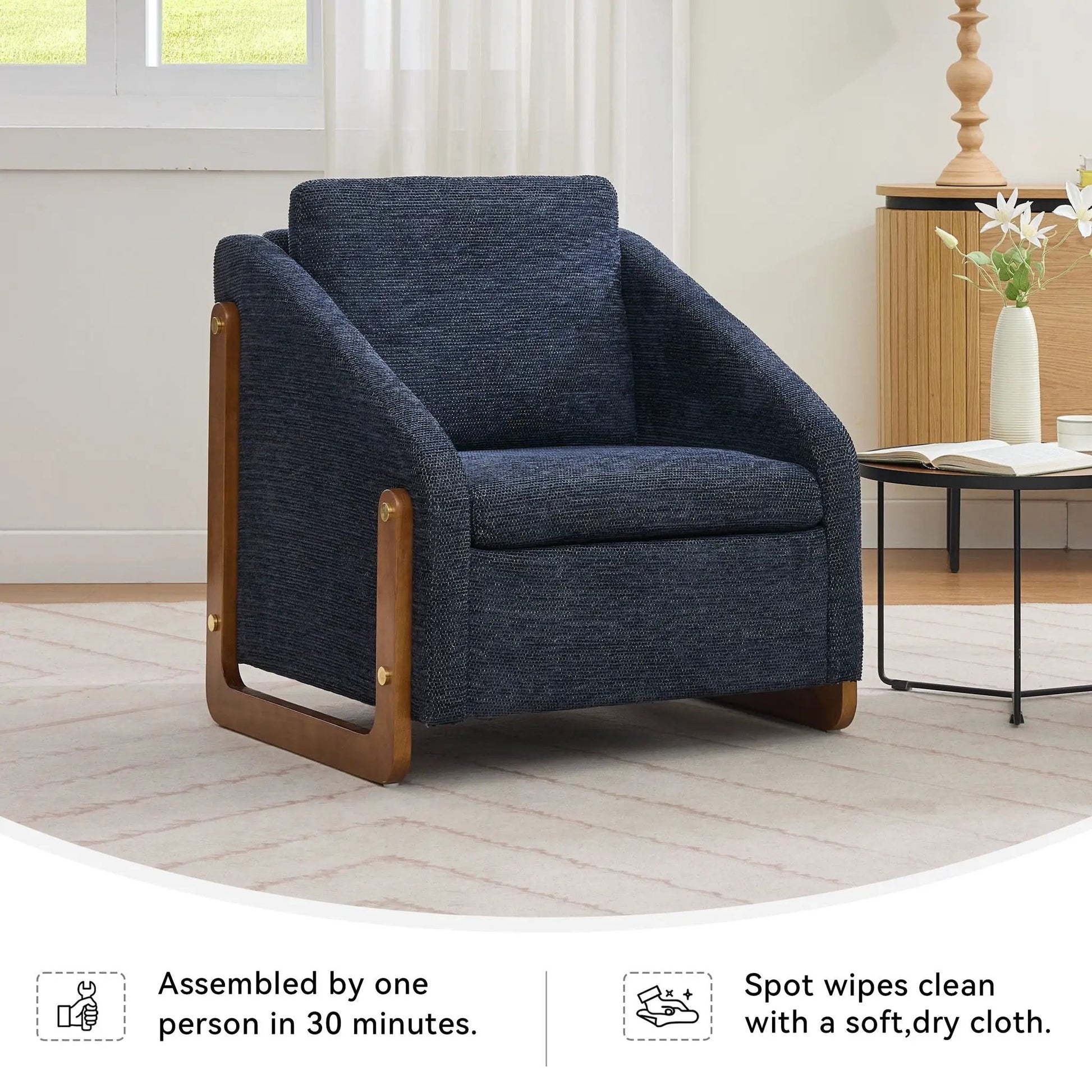 Modern upholstered armchair in navy textured fabric with a wooden side frame on Tampa Home & Garden Store
