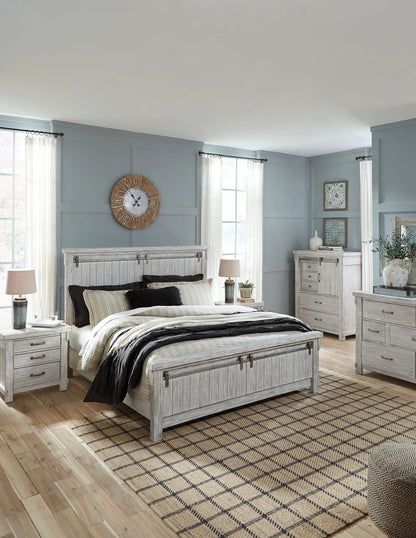 Norbert table lamp with dark ceramic base and cream shade on a nightstand on Tampa Home & Garden Store