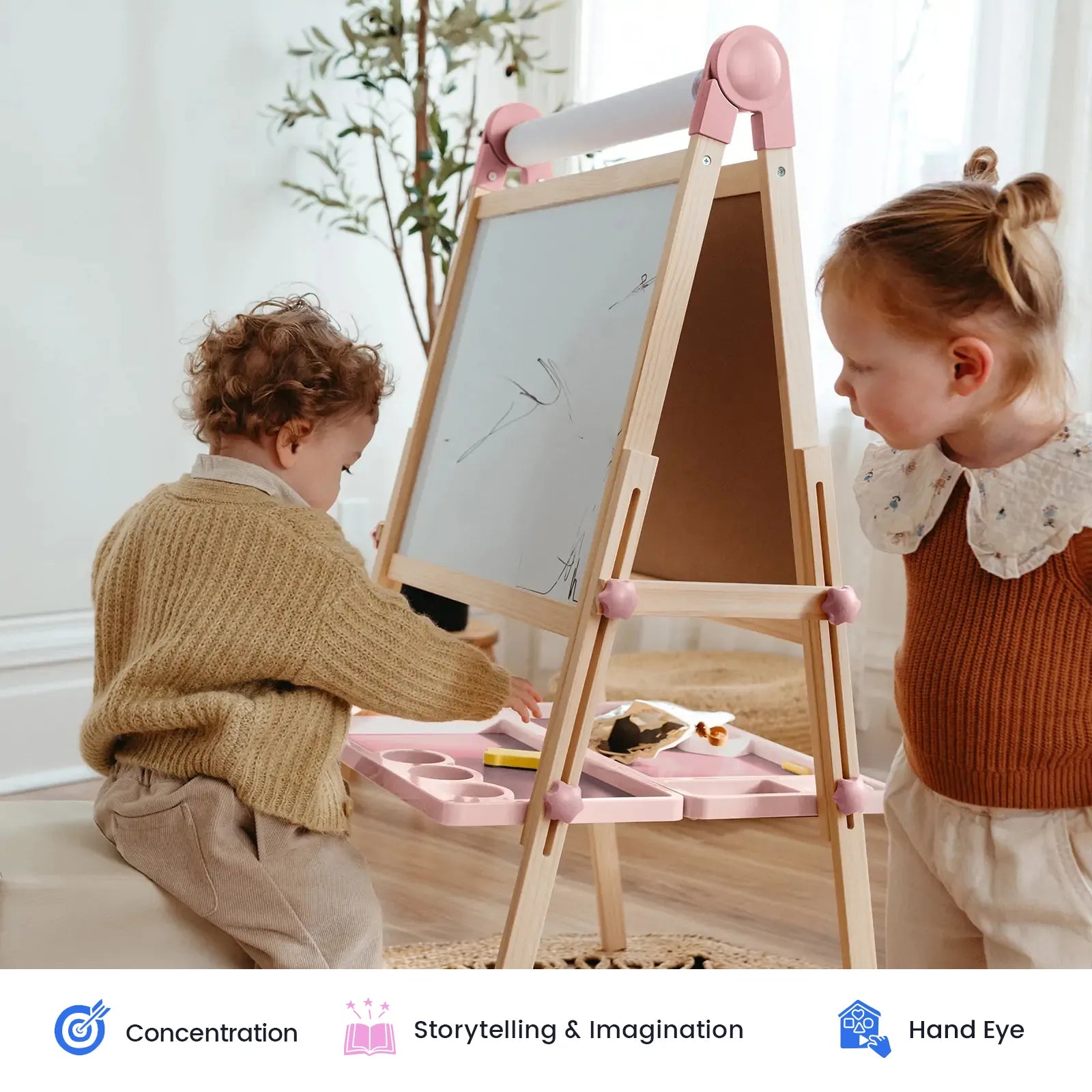 Tiny Land Pink Magnitales kids easel with paper roll, wooden frame, two children drawing on Tampa Home & Garden Store