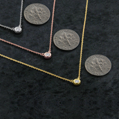 Bezel-set diamond pendant necklace in white gold with round diamond; rose and yellow gold on Tampa Home & Garden Store