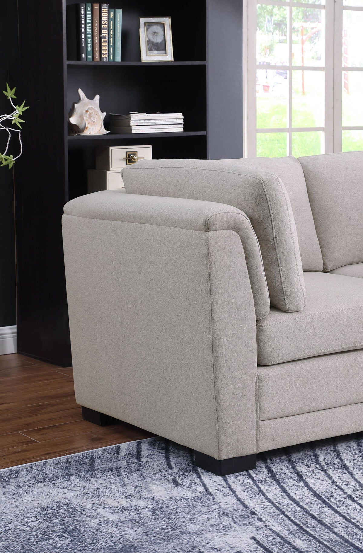 Light gray Kristin loveseat with removable cushions, stationary design, modern living room scene on Tampa Home & Garden Store