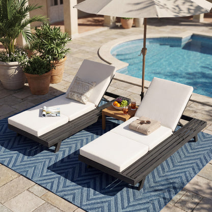 Acacia wood outdoor chaise sunlounger with durable white cushion; pair by pool on blue rug on Tampa Home & Garden Store