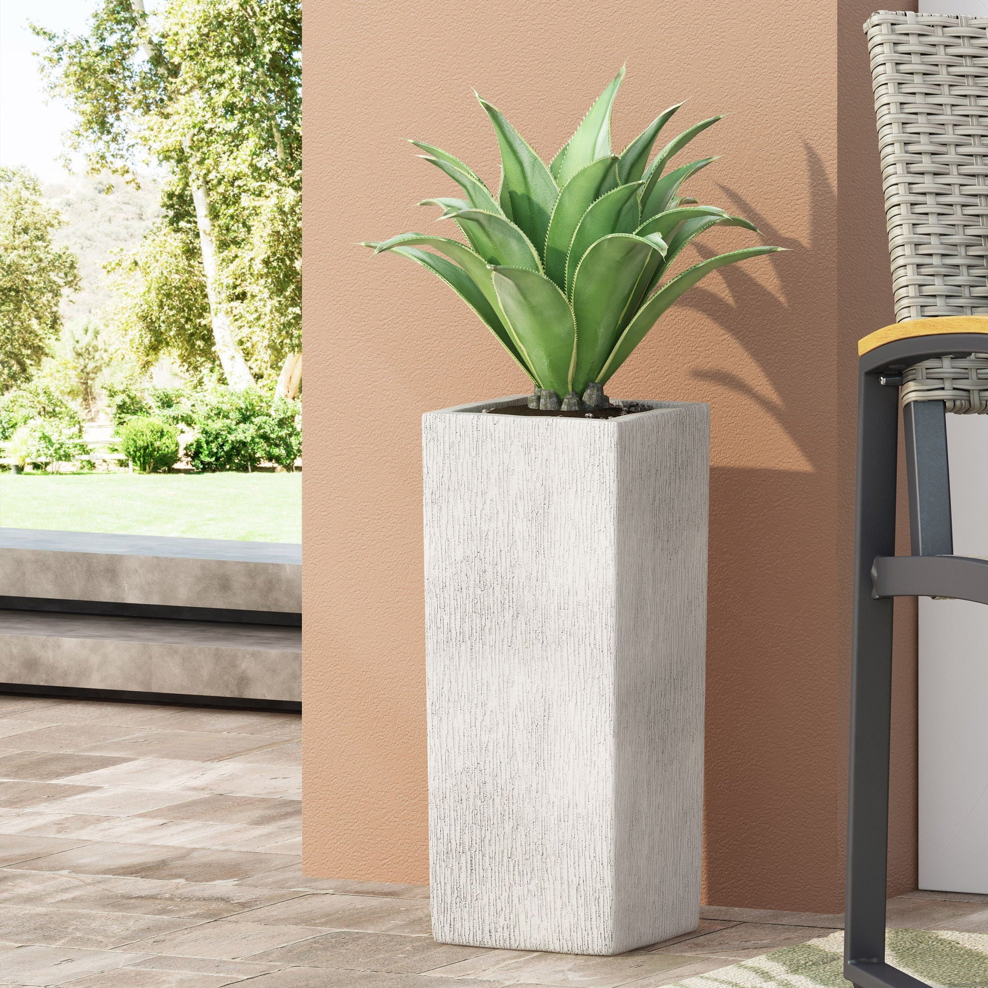Modern Outdoor Planter; white textured concrete pot with green agave outdoors against peach wall on Tampa Home & Garden Store