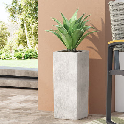 Modern Outdoor Planter; white textured concrete pot with green agave outdoors against peach wall on Tampa Home & Garden Store