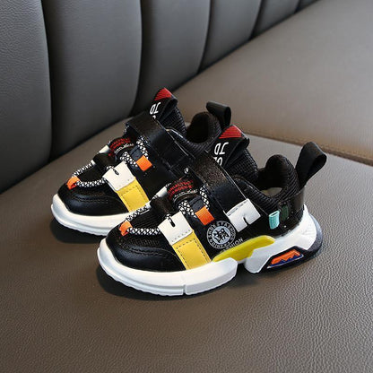 Stevvex baby sneakers pair black with yellow white orange accents, soft breathable non-slip sole on Tampa Home & Garden Store