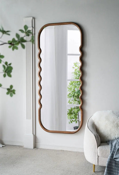 Oversized wooden floor mirror with brown wavy frame on Tampa Home & Garden Store