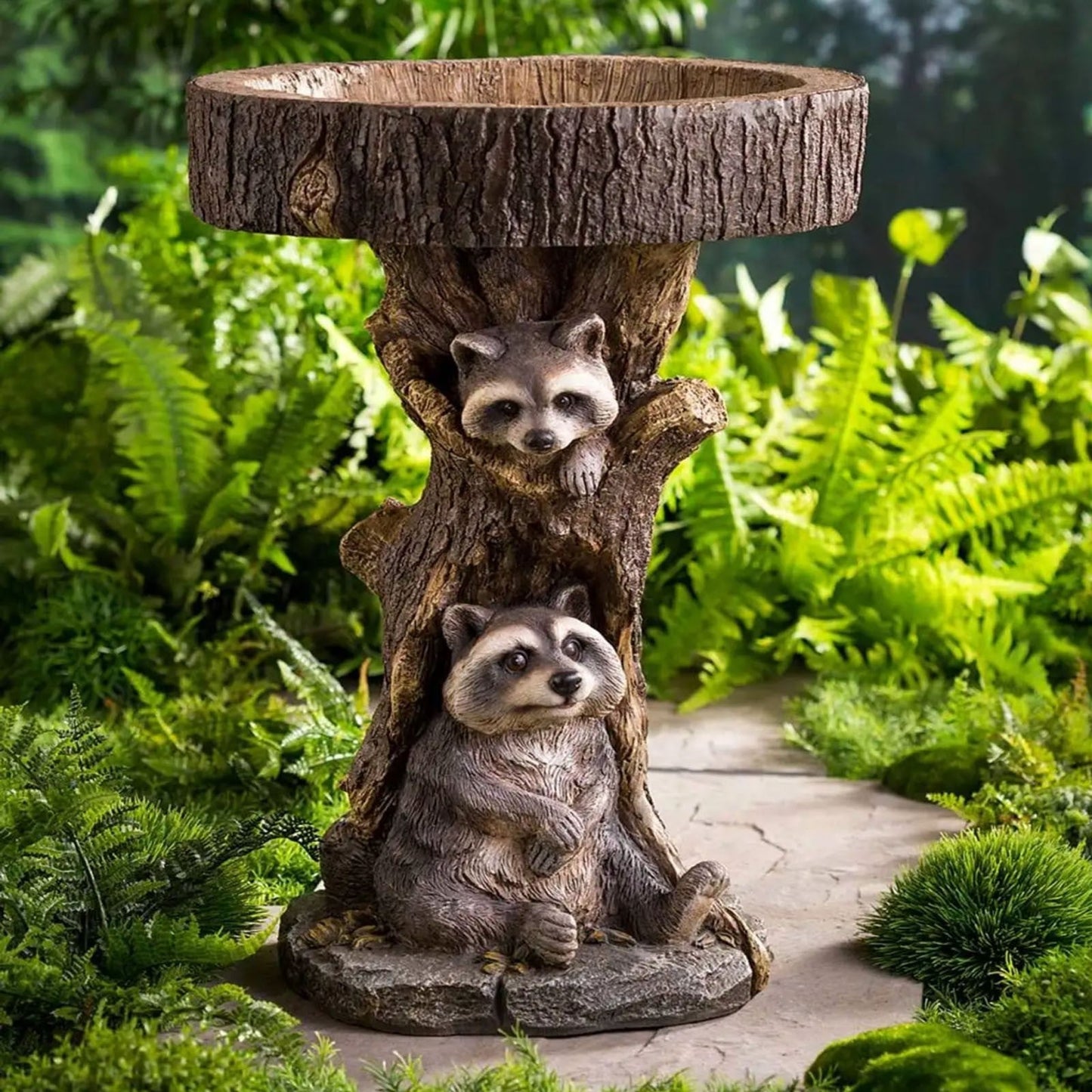 Raccoon resin garden ornaments with three figures on a textured tree trunk birdbath on Tampa Home & Garden Store
