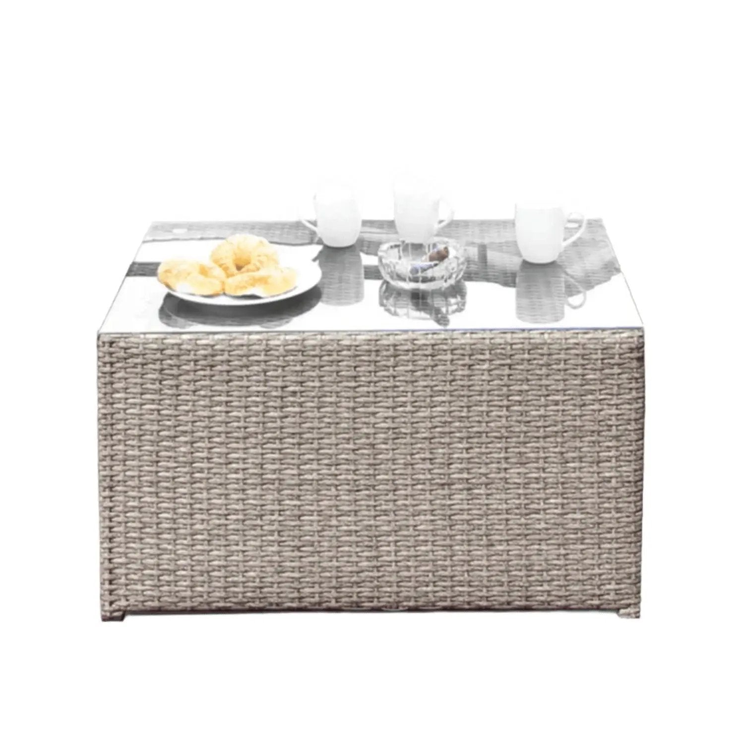 Coffee Table Stylish with glass top and woven wicker base; plate of croissants and 3 white mugs on Tampa Home & Garden Store