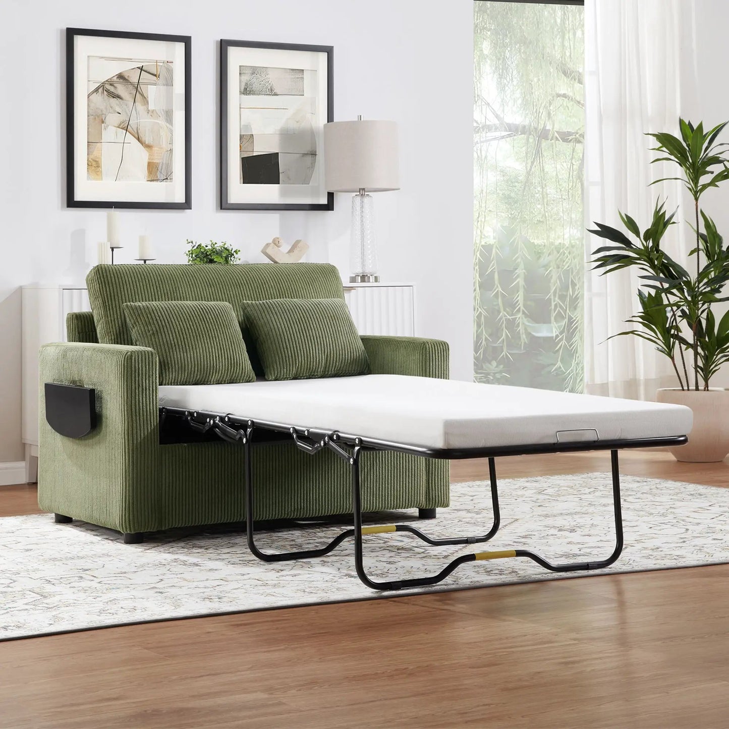 Sleeper sofa with fold-out mattress in green corduroy upholstery and black metal frame on Tampa Home & Garden Store