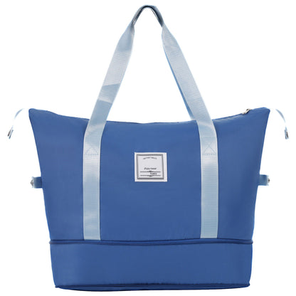 Blue luggage bag with light blue web straps and front label patch on Tampa Home & Garden Store