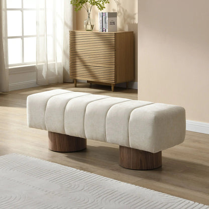 Upholstered dining bench in light beige fabric with rounded edges and wooden legs on Tampa Home & Garden Store