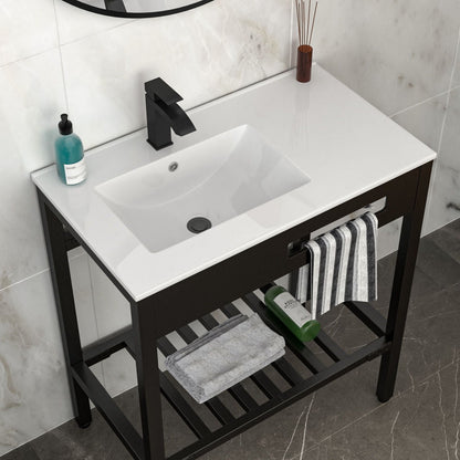 Console sink vanity with white porcelain basin and black matte steel legs in bathroom on Tampa Home & Garden Store