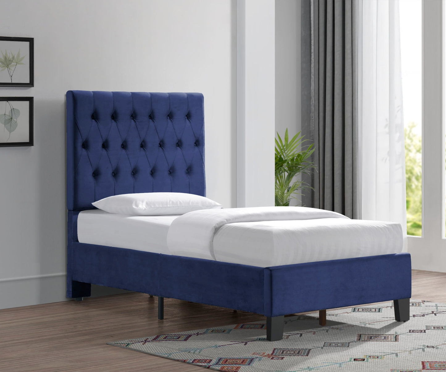 Luma upholstered bed with blue tufted headboard and white bedding on Tampa Home & Garden Store