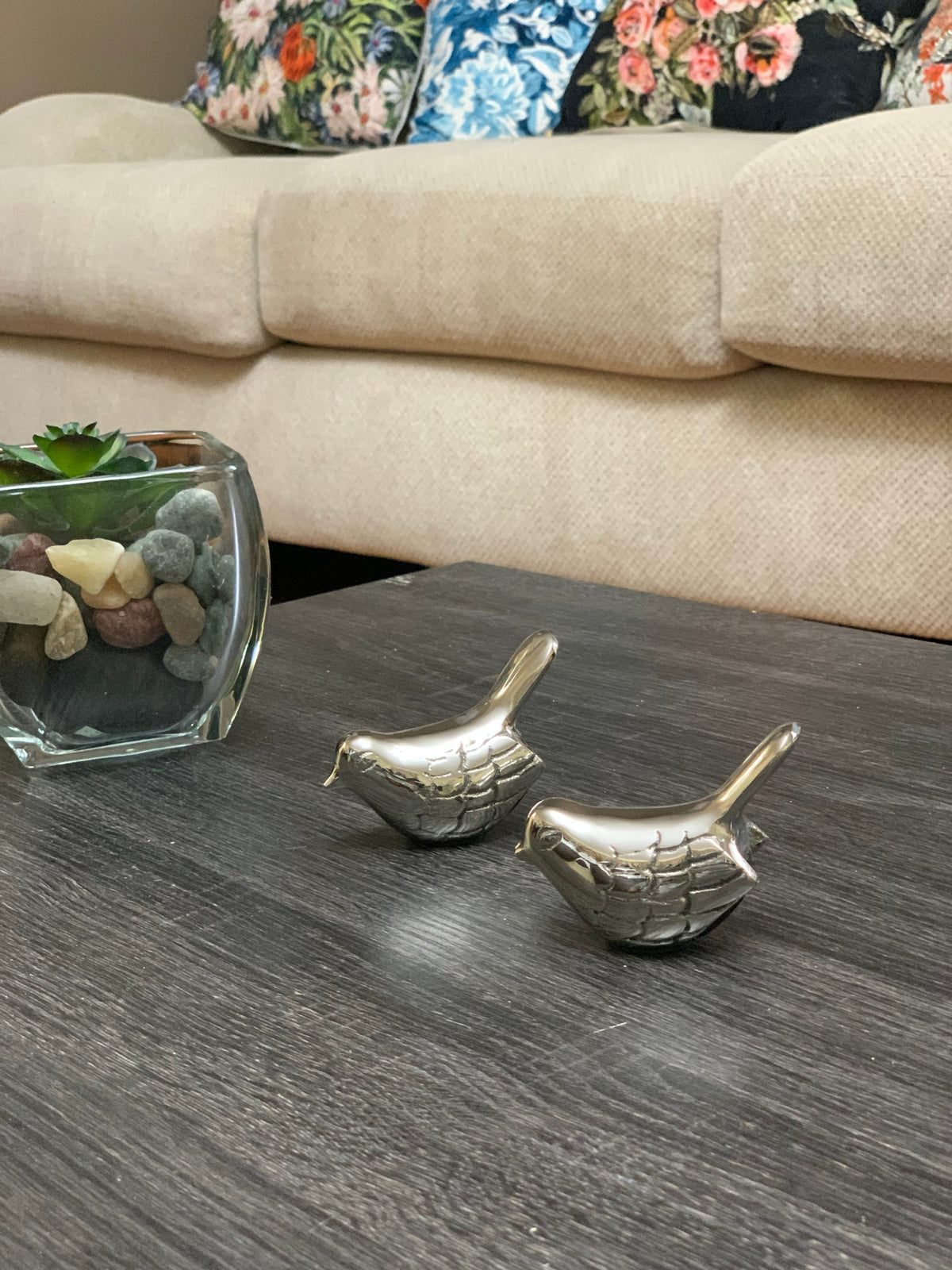 Vibhsa silver rustic pair of bird figurines on dark wood table beside glass succulent planter on Tampa Home & Garden Store